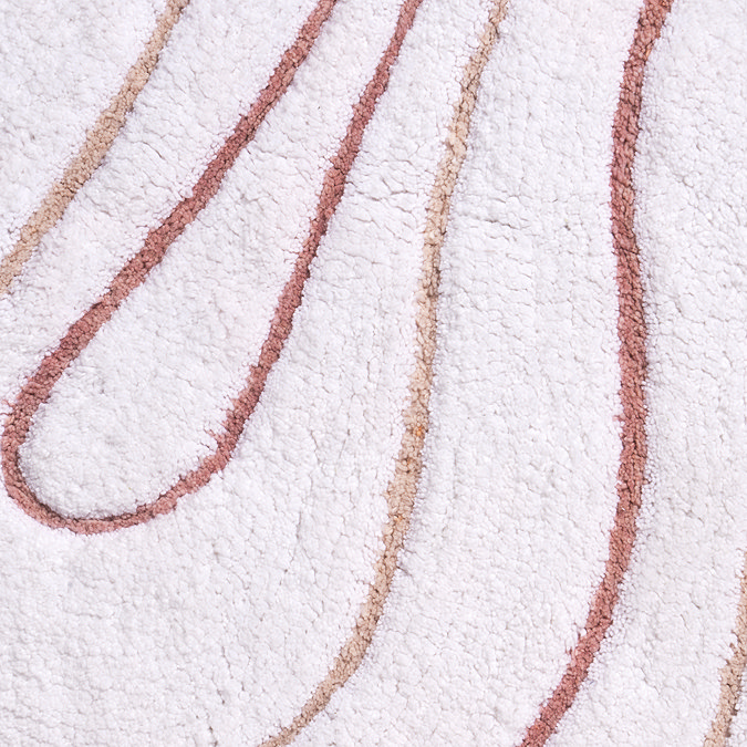 Close up image of the tighter swirls on the Croydex Pink and White Swirls Bath Mat.