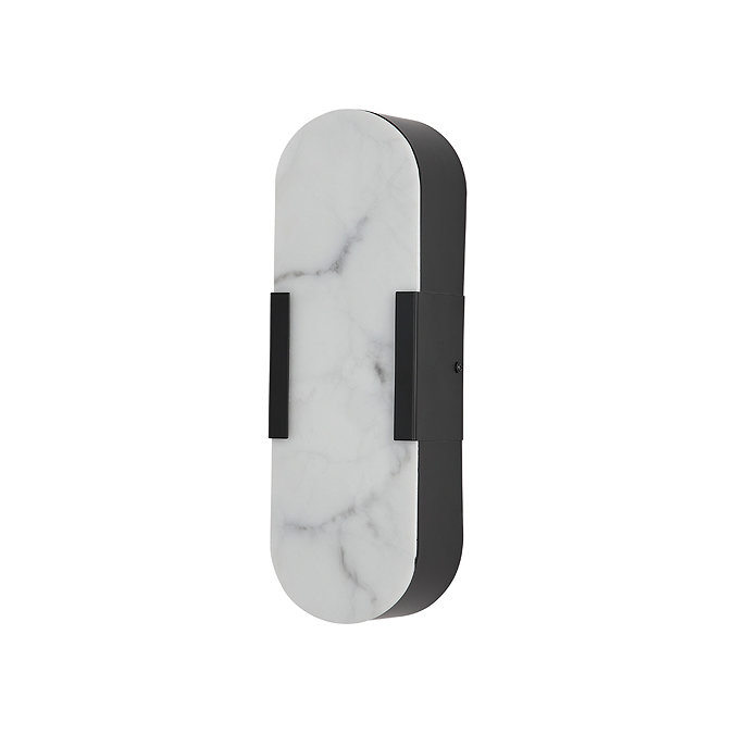 A wall‑mounted light with an oval white marble‑effect front panel and matte black sides, shown switched off.