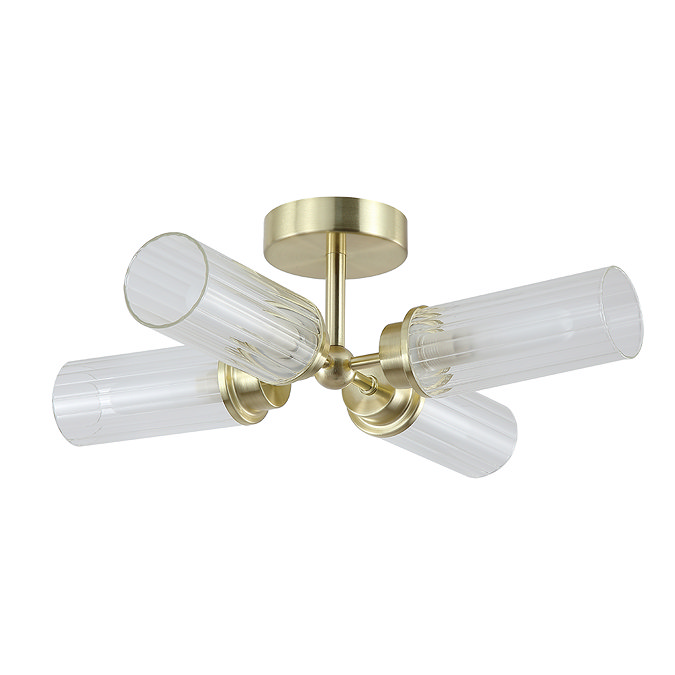 A satin brass four‑light flush ceiling fitting with four clear ribbed glass cylinders arranged in a cross pattern, shown switched off.