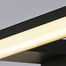 Close‑up view of the glowing frosted diffuser and matt black frame of the slim horizontal mirror light.