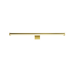 A slim, modern gold mirror light with a long horizontal diffuser glowing softly, supported by a central bracket.