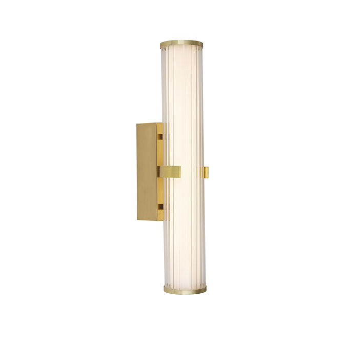 A clamp‑style wall light with a glowing ribbed opal glass tube held in place by a central gold metal clamp