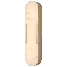 A tall wall‑mounted light with an elongated oval marble‑effect diffuser framed in matt gold, glowing softly to show the light is switched on.