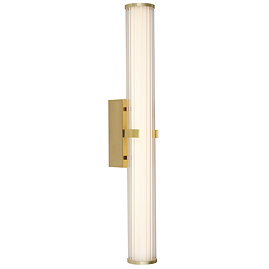 A gold clamp‑style wall light with a glowing ribbed opal glass tube held in place by a central gold metal clamp.