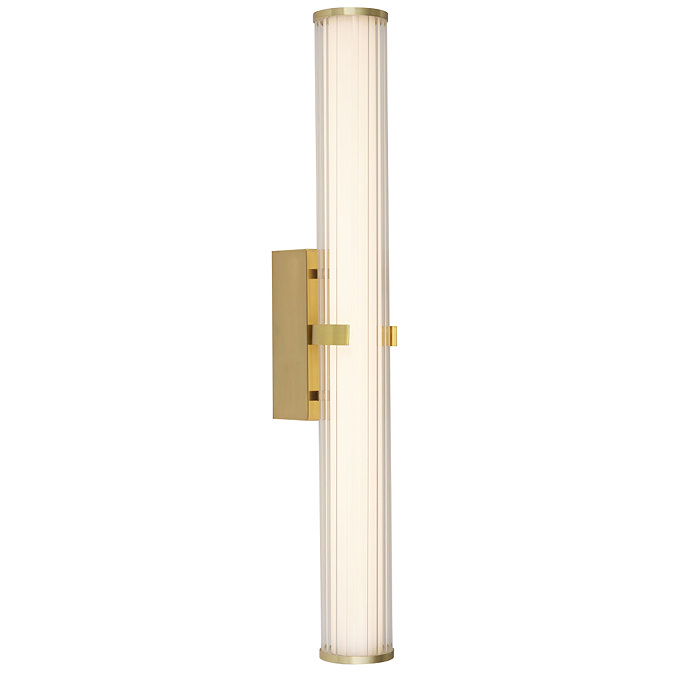 A gold clamp‑style wall light with a glowing ribbed opal glass tube held in place by a central gold metal clamp.