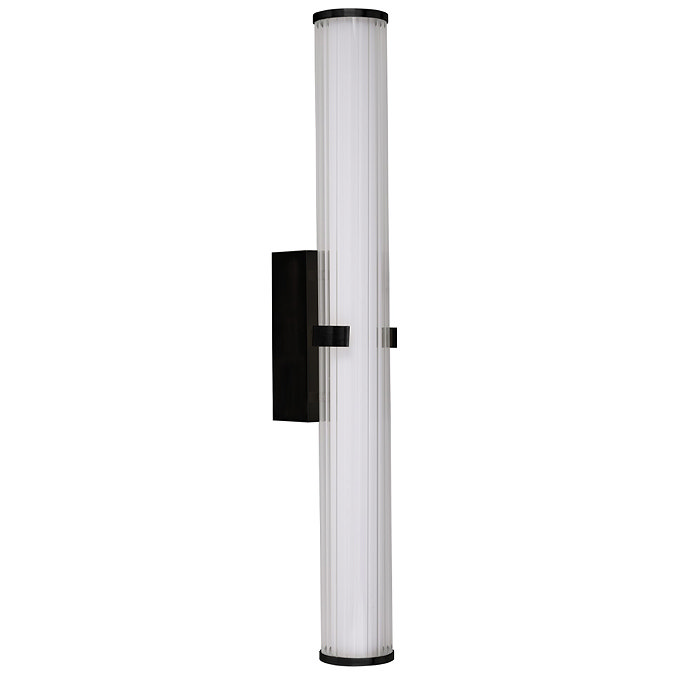 A matt black clamp‑style wall light with a tall ribbed opal glass tube held at the centre by a black metal clamp, shown switched off.