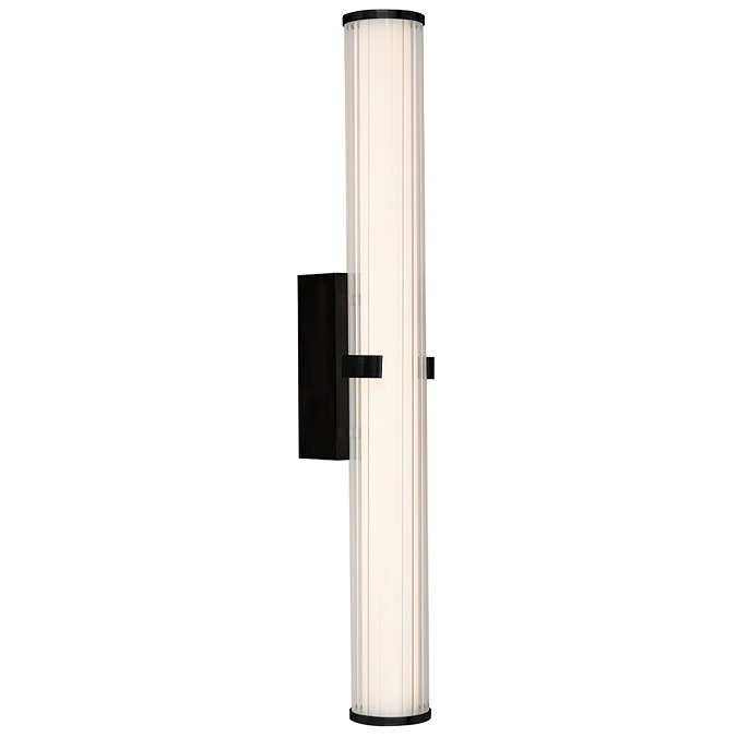 A matt black clamp‑style wall light with a glowing ribbed opal glass tube held in place by a central black metal clamp.