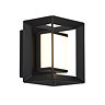 A small black square wall light with an opal acrylic centre glowing softly inside the open metal frame.