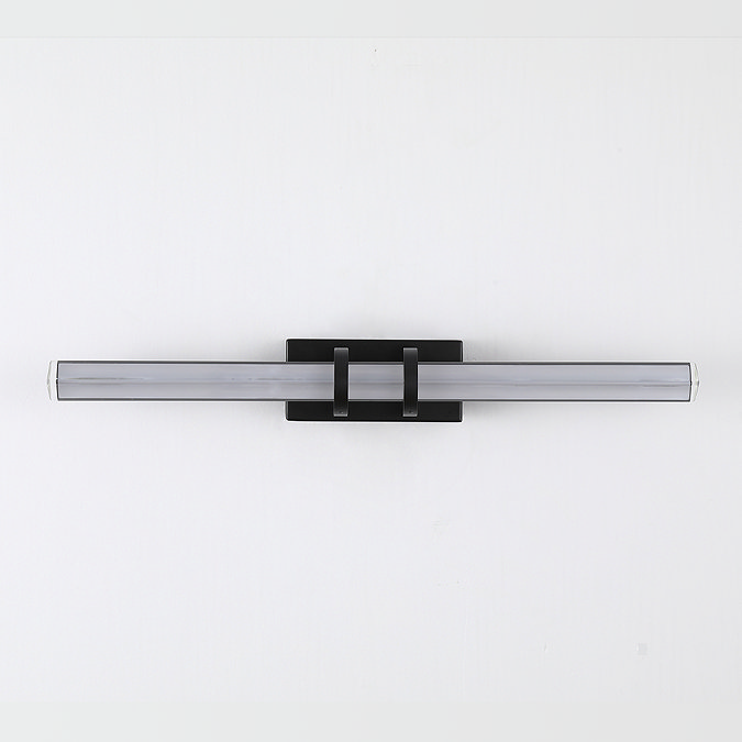 A slim matt black wall light with a long, clear glass diffuser supported by two black brackets on a rectangular backplate, shown switched off.