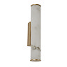A tall wall light with a white marble‑effect cylindrical diffuser mounted on a matt gold rectangular backplate, shown switched off.