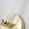 Close‑up view of a satin‑brass wall light showing the textured clear acrylic cylinder and part of the round brass base.