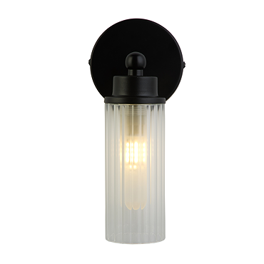 A matt black wall light with a clear ribbed glass cylinder and a round black wall plate, shown switched off.