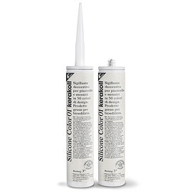 Two Kerakoll Silicone Color white sealant tubes standing upright, one with nozzle attached and one with cap.