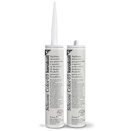 Two Kerakoll Silicone Color cream sealant tubes standing upright, one with nozzle attached and one with cap.