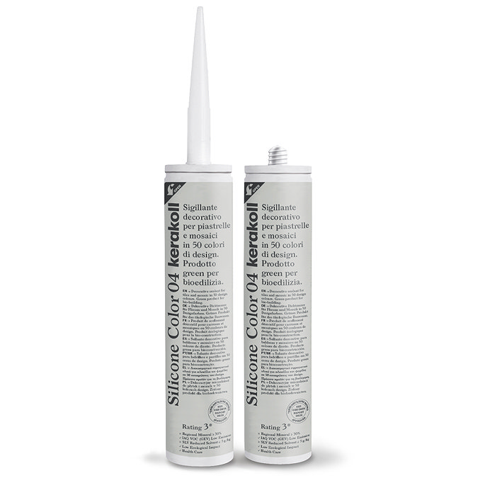Two Kerakoll Silicone Color cream sealant tubes standing upright, one with nozzle attached and one with cap.