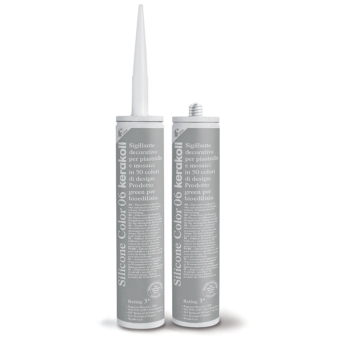 Two Kerakoll Silicone Color grey sealant tubes standing upright, one with nozzle attached and one with cap.