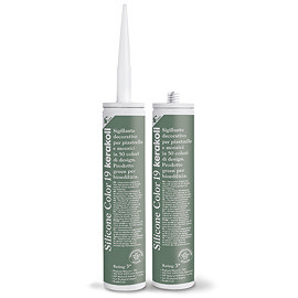 Two Kerakoll Silicone Color green sealant tubes standing upright, one with nozzle attached and one with cap.