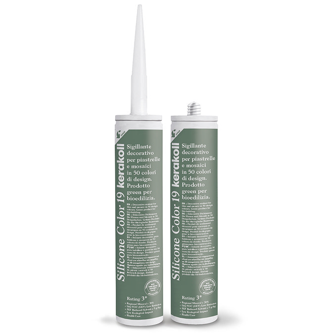 Two Kerakoll Silicone Color green sealant tubes standing upright, one with nozzle attached and one with cap.