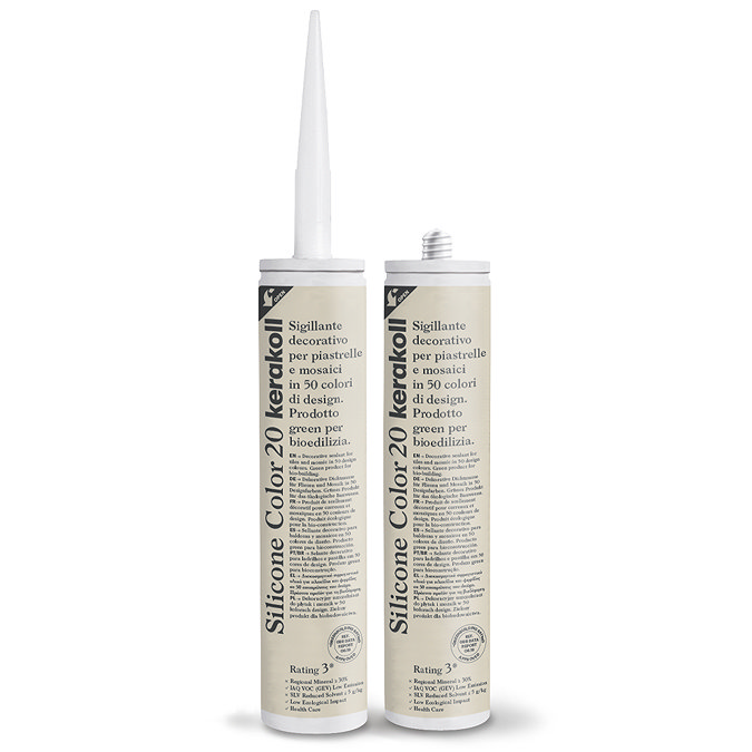 Two Kerakoll Silicone Color light beige sealant tubes standing upright, one with nozzle attached and one with cap.