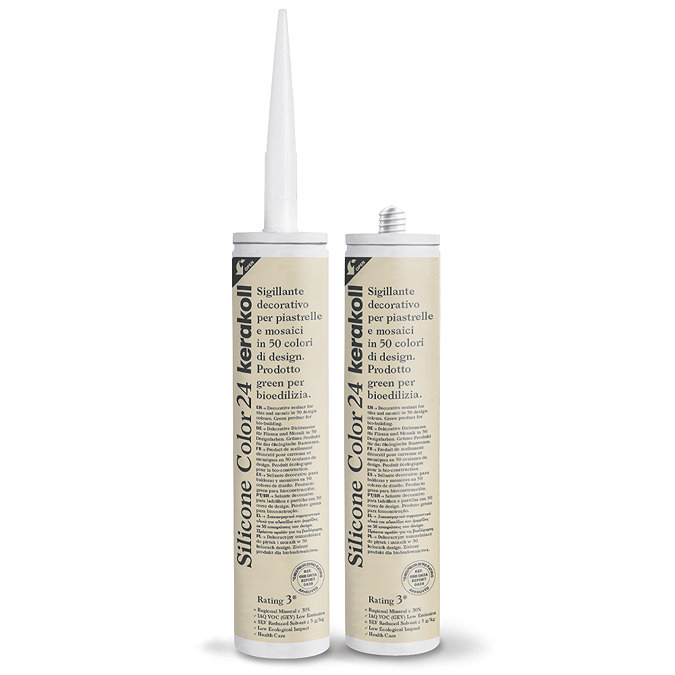 Two Kerakoll Silicone Color light beige sealant tubes standing upright, one with nozzle attached and one with cap.
