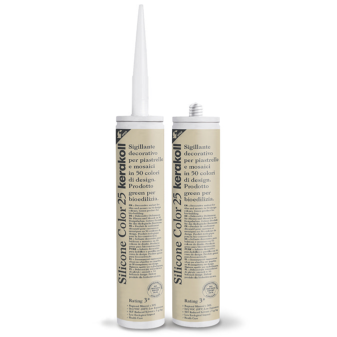 Two Kerakoll Silicone Color light beige sealant tubes standing upright, one with nozzle attached and one with cap.