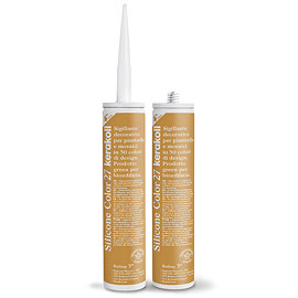 Two Kerakoll Silicone Color orange sealant tubes standing upright, one with nozzle attached and one with cap.