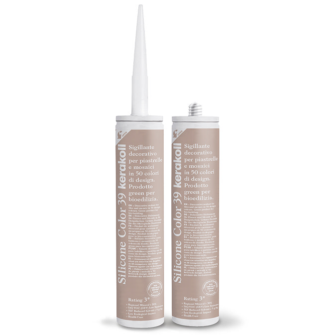 Two Kerakoll Silicone Color light brown sealant tubes standing upright, one with nozzle attached and one with cap.