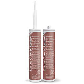 Two Kerakoll Silicone Color reddy-brown sealant tubes standing upright, one with nozzle attached and one with cap.