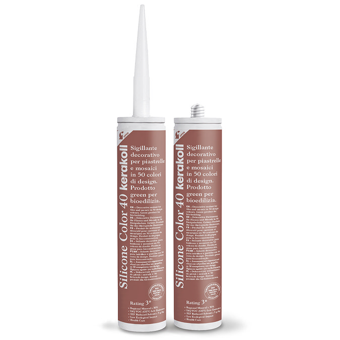 Two Kerakoll Silicone Color reddy-brown sealant tubes standing upright, one with nozzle attached and one with cap.