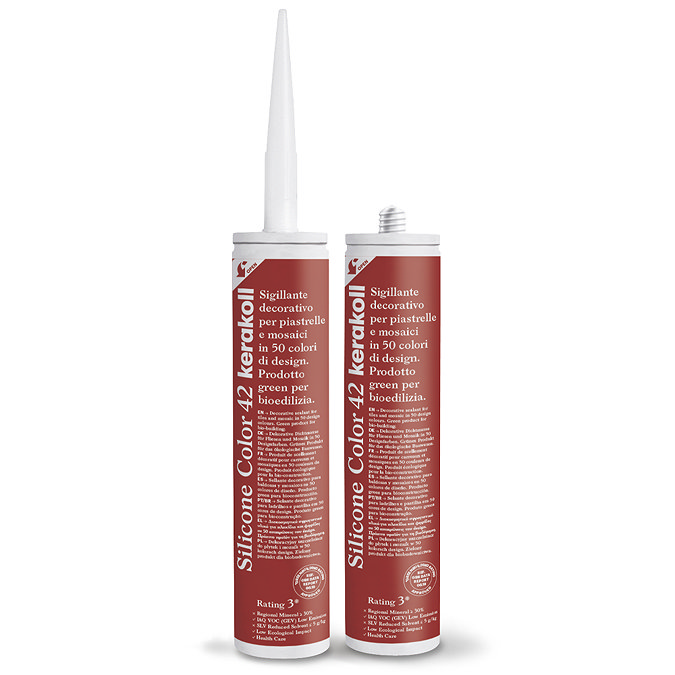 Two Kerakoll Silicone Color red sealant tubes standing upright, one with nozzle attached and one with cap.