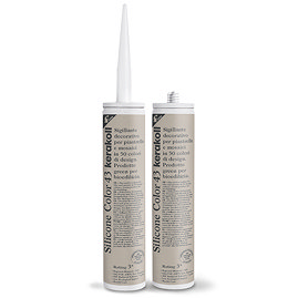 Two Kerakoll Silicone Color brown sealant tubes standing upright, one with nozzle attached and one with cap.