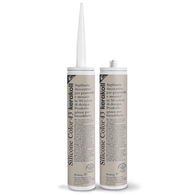 Two Kerakoll Silicone Color brown sealant tubes standing upright, one with nozzle attached and one with cap.