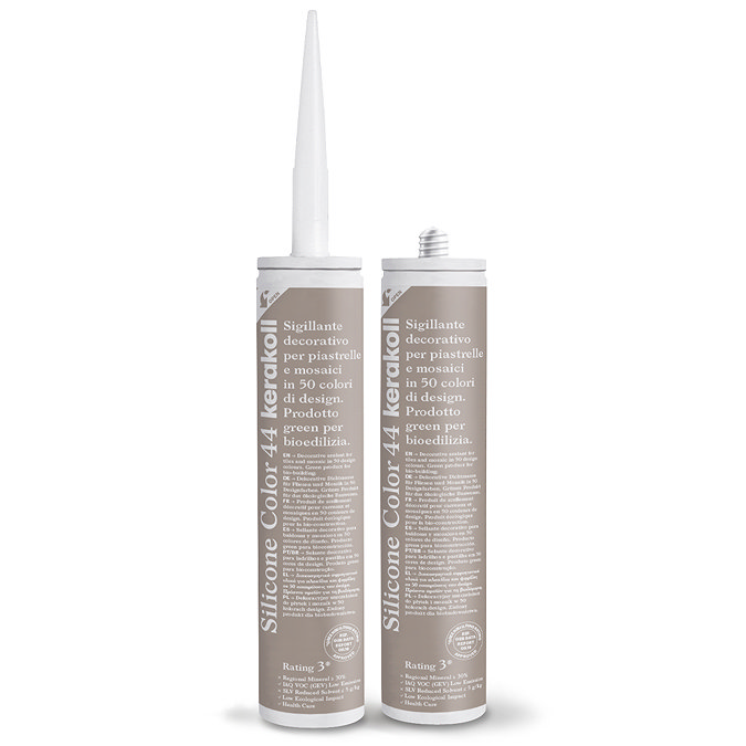 Two Kerakoll Silicone Color brown sealant tubes standing upright, one with nozzle attached and one with cap.