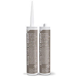 Two Kerakoll Silicone Color brown sealant tubes standing upright, one with nozzle attached and one with cap.