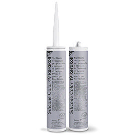 Two Kerakoll Silicone Color grey sealant tubes standing upright, one with nozzle attached and one with cap.