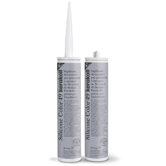 Two Kerakoll Silicone Color grey sealant tubes standing upright, one with nozzle attached and one with cap.