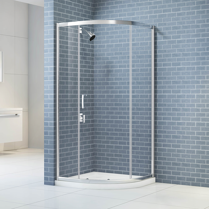 Merlyn IQ 1 door quadrant shower enclosure installed in a bathroom setting, featuring a chrome frame and clear glass panels.