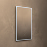 The Roxbury 600 x 800mm Illuminated Rectangular Mirror with Demister Pad pictured on a plain beige wall, showing the mirror light turned off.