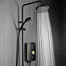 Triton Amala DuElec 9.5kW electric shower in brushed brass and black, showing the rainfall shower head in use with water flowing and the handheld shower mounted on the riser rail.
