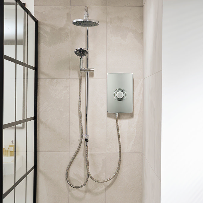 Triton Aspirante DuElec electric shower installed in a modern bathroom setting, showing the shower unit alongside the rainfall and handheld shower heads.