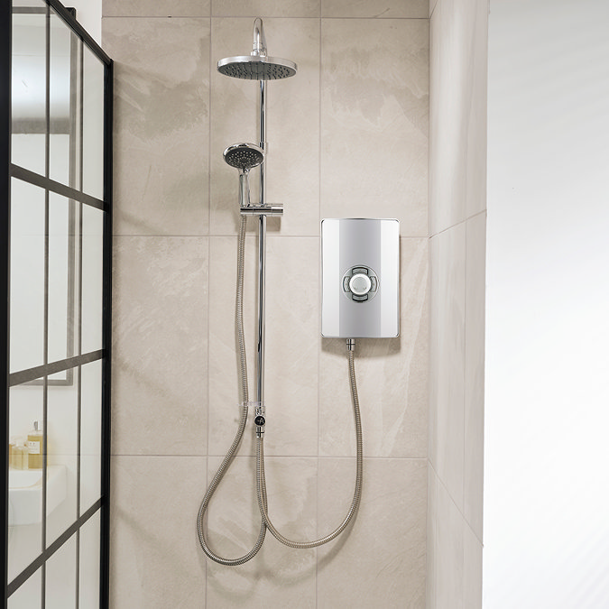 Triton Aspirante DuElec electric shower installed in a modern bathroom setting, showing the shower unit alongside the rainfall and handheld shower heads.
