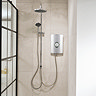 Triton Aspirante DuElec electric shower installed in a modern bathroom setting, showing the shower unit alongside the rainfall and handheld shower heads.