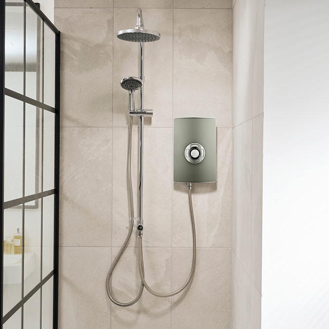 Triton Aspirante DuElec electric shower installed in a modern bathroom setting, showing the shower unit alongside the rainfall and handheld shower heads.