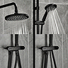 Close-up of the Triton DuoSwitch black rainfall shower head and handset in use, showing the positioning of the hose depending on if the shower head or handset is in use.