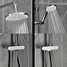 Close-up of the Triton DuoSwitch white and chrome rainfall shower head and handset in use, showing the positioning of the hose depending on if the shower head or handset is in use.